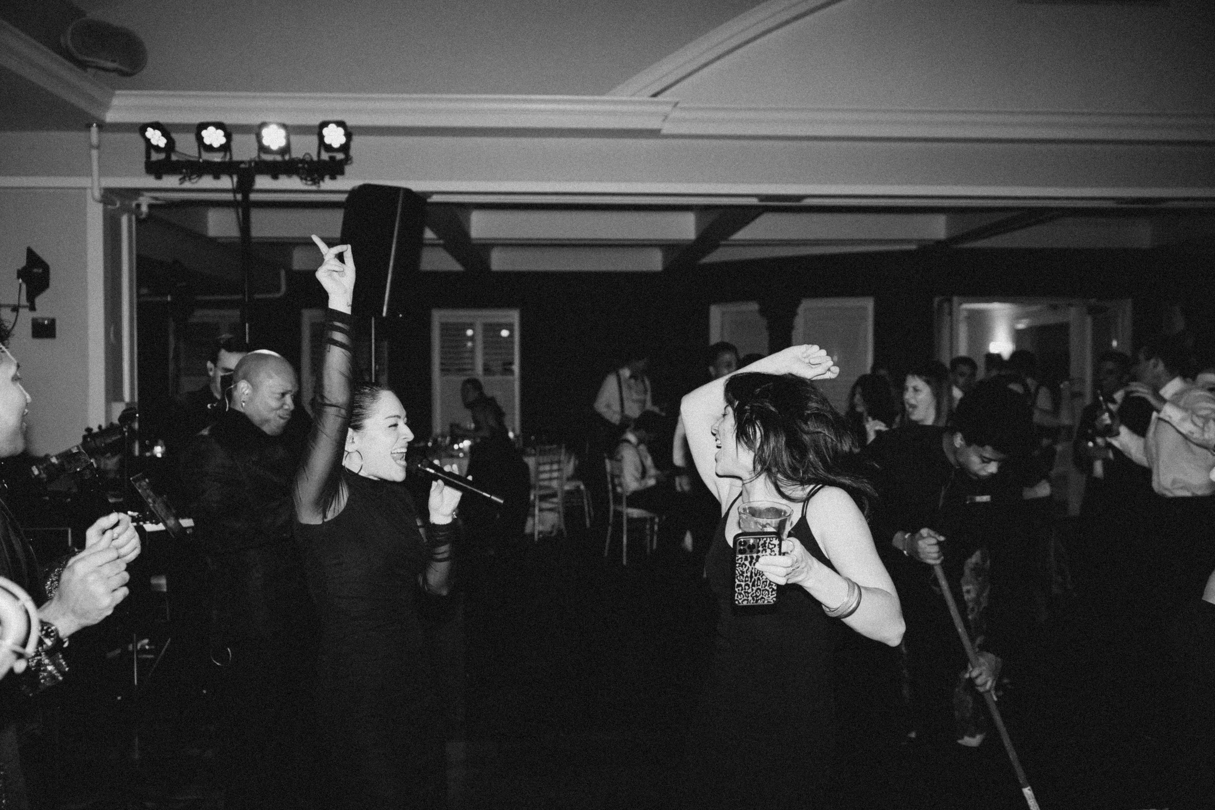 Guests dancing energetically on the dance floor at a lively wedding reception with Soul City Band performing live in Newport, RI