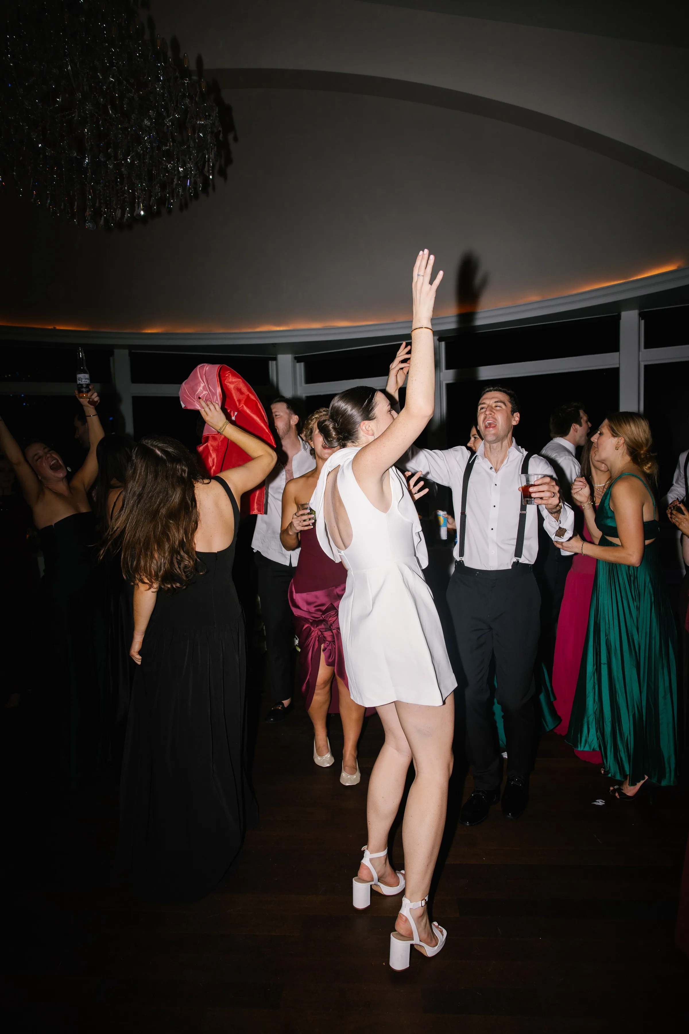 Guests dancing energetically on the wedding reception dance floor during a live band performance by Soul City Band in Newport, RI